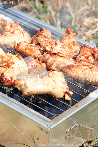 Image of BBQ. Close up photo of cooking meet on the open fire