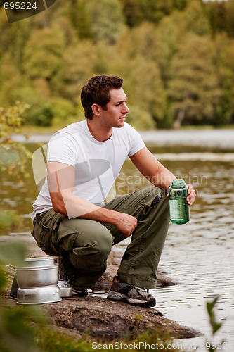 Image of Man Getting Water