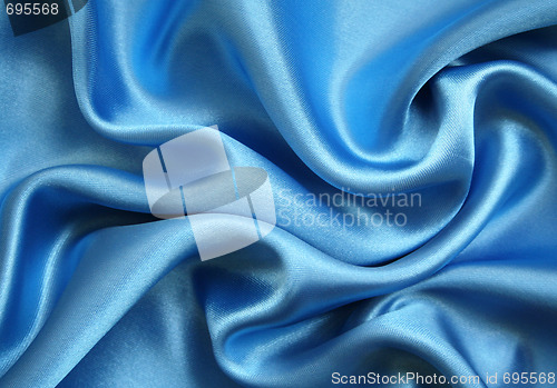 Image of Smooth elegant blue silk as background