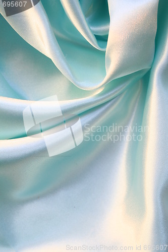 Image of Smooth elegant blue silk as background 