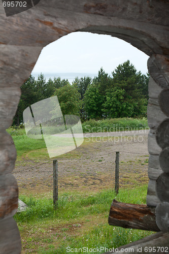 Image of Wood through arch from log