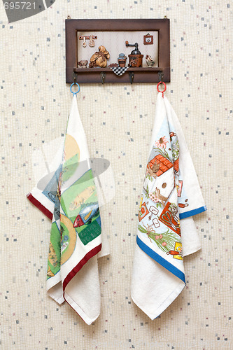 Image of Dishtowels hung on wooden hatrack