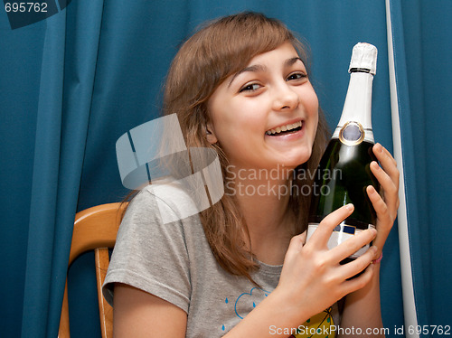 Image of Girl with bottle champaign smiles
