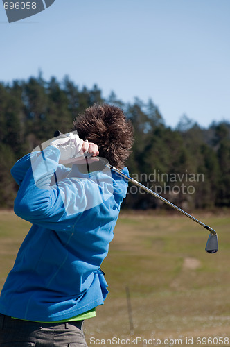 Image of Male golfer in his finish