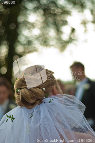 Image of Bride facing groom unfocused