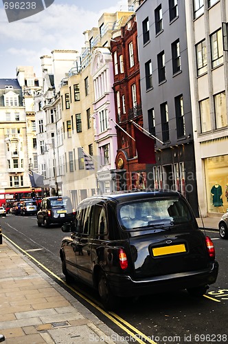 Image of London taxi on shopping street