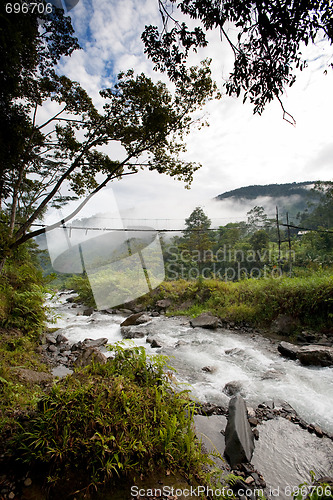 Image of River with Hanging Bridge