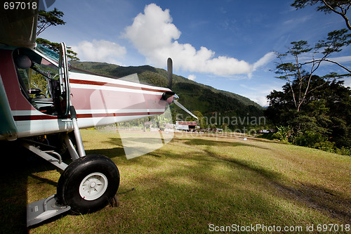 Image of Airplane on Mountain Runway