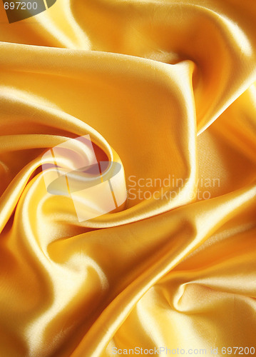 Image of Smooth elegant golden satin as background 