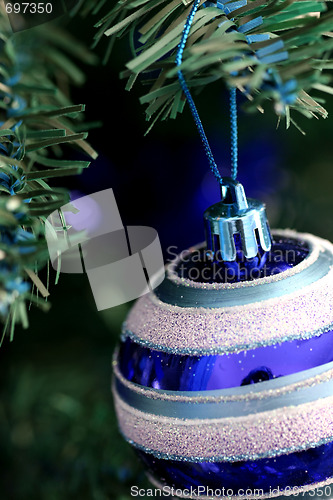 Image of Christmas ornaments on tree.