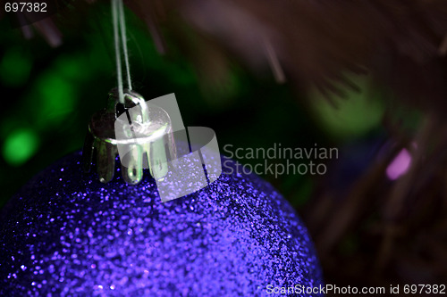 Image of Christmas ornaments on tree.