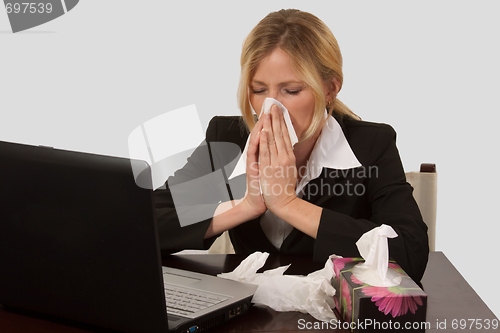 Image of Woman blowing nose