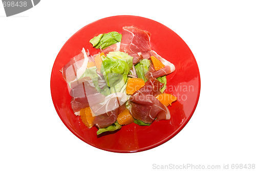 Image of jamon with orange fruit and lettuce