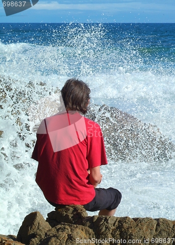 Image of Man in red sea spray