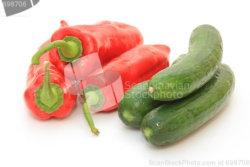 Image of Tasty kitchen. Fresh vegetables isolated on white