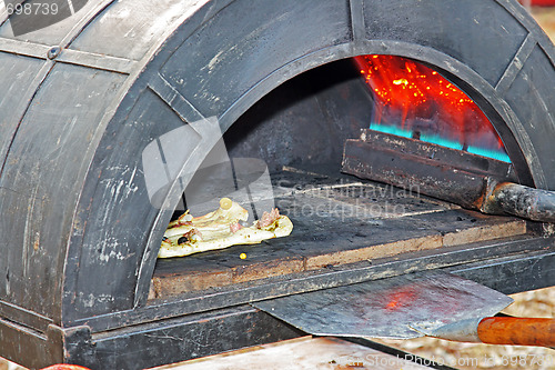 Image of Preparing a tasty pizza in the oven