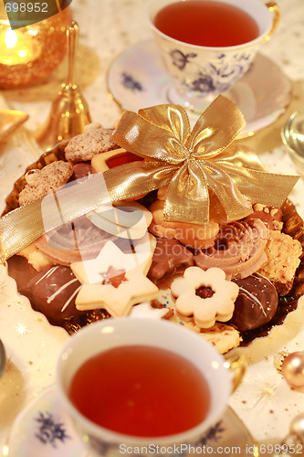 Image of Hot tea with sweet cookies