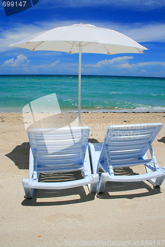 Image of Beach Umbrella and Lounge Chairs