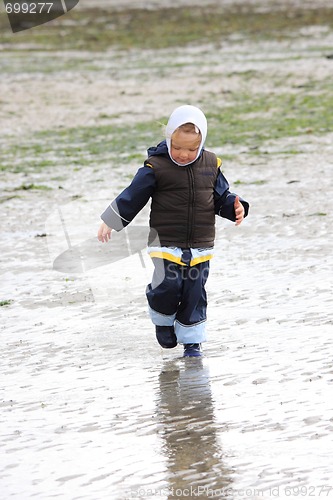 Image of little girl on low tide tideland