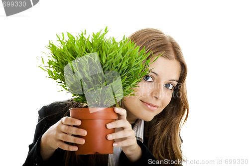 Image of Business Woman holding a vase with a plant