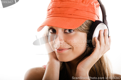 Image of Young woman listen music