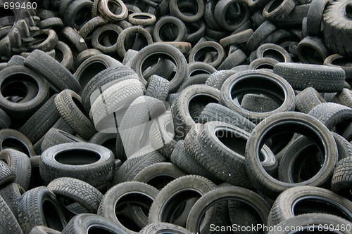 Image of Old tires on junk yard