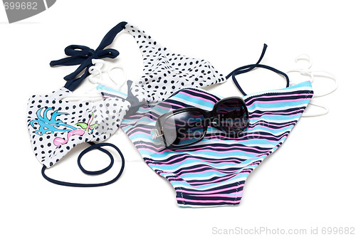 Image of Sunglasses to rest upon swimsuit