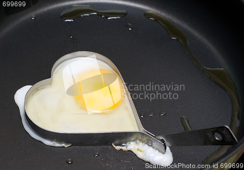 Image of Fried egg in iron form heart crop