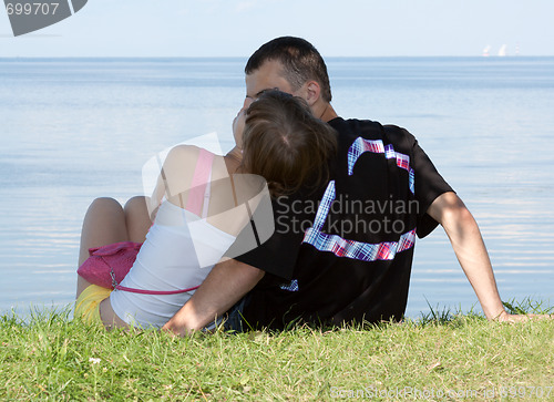 Image of Lad and girl sit on herb