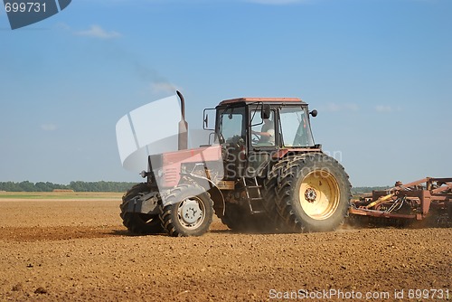 Image of Agriculture ploughing tractor outdoors