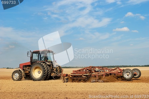 Image of Agriculture ploughing tractor outdoors