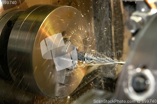 Image of drilling a hole in blank on turning machine