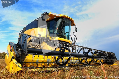 Image of harvesting combine in the field