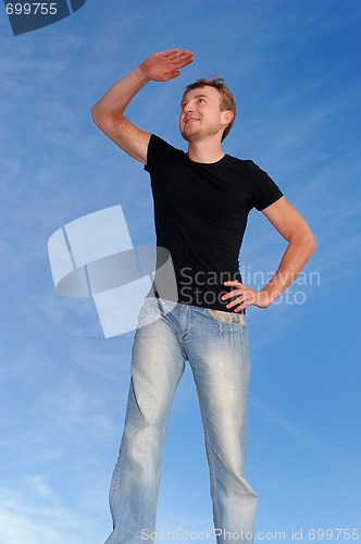 Image of young smiling man outdoors