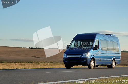 Image of Blue minibus on highway