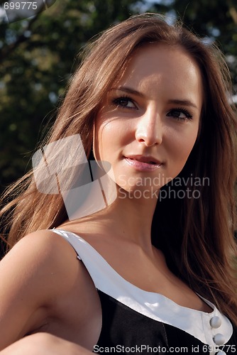 Image of Beautiful young girl outdoors in summer