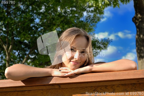 Image of Beautiful young girl outdoors in summer