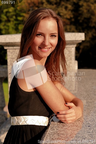 Image of Beautiful young girl outdoors in summer