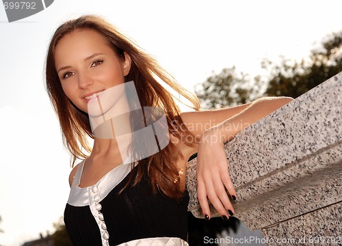 Image of Beautiful young girl outdoors in summer