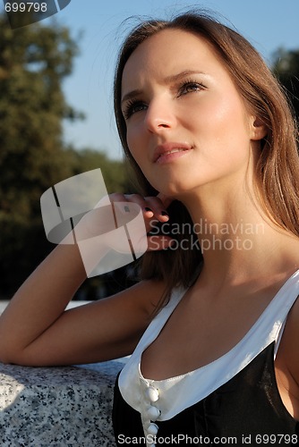 Image of Beautiful young girl outdoors in summer