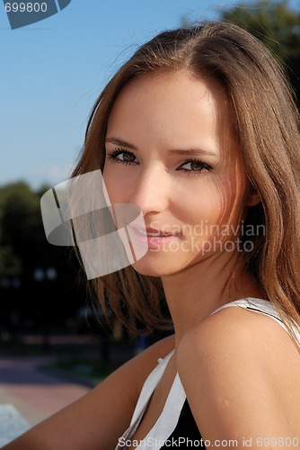 Image of Beautiful young girl outdoors in summer