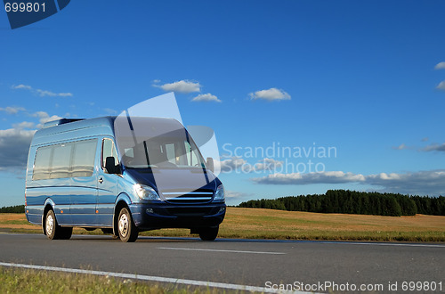 Image of Blue minibus on highway