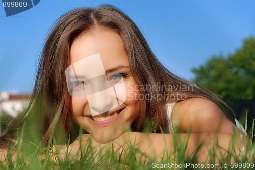 Image of smiling girl on the grass