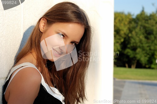 Image of Beautiful young girl outdoors in summer