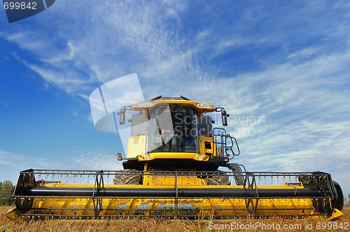 Image of combine in the field