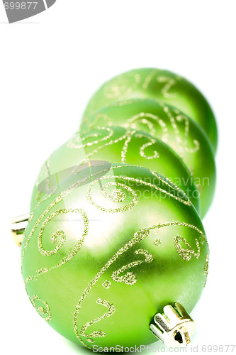 Image of four green christmas balls 