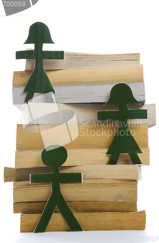 Image of Green People on a pile of books