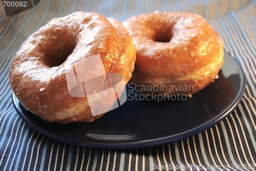 Image of two glazed doughnuts