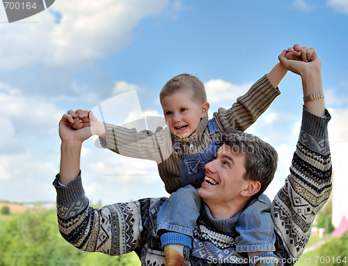 Image of couple of boy and young man playing