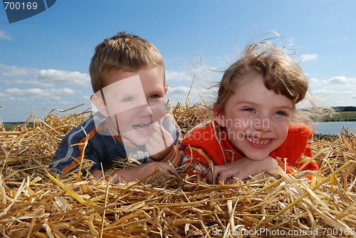 Image of smiling boy and girl outdoors